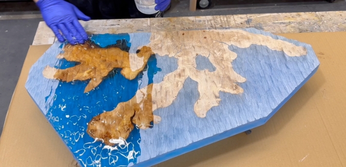 making a blue coral leaf made with deep pour epoxy resin and olivewood